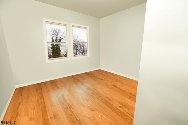 14 Hazel Place Newark, NJ 07108 - Photo 5 of 10 a view of empty room with wooden floor