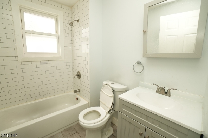 14 Hazel Place Newark, NJ 07108 - Photo 6 of 10 a bathroom with a sink a toilet and a bathtub