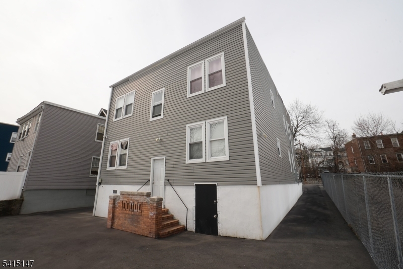 14 Hazel Place Newark, NJ 07108 - Photo 8 of 10 a view of a house with a yard