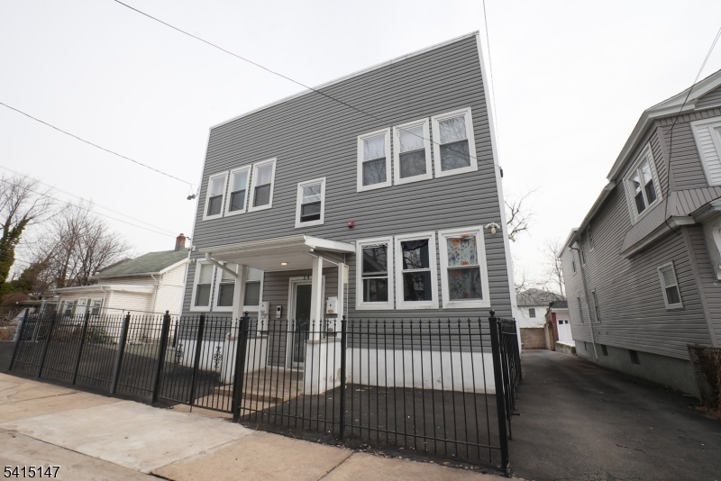 14 Hazel Place Newark, NJ 07108 - Photo 10 of 10 a view of a brick house with many windows