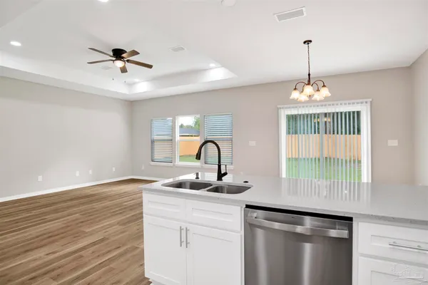 a kitchen with a sink and a window