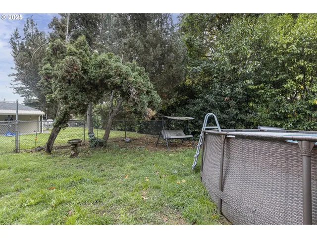 a backyard of a house with lots of green space