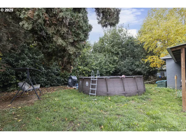a backyard of a house with lots of green space