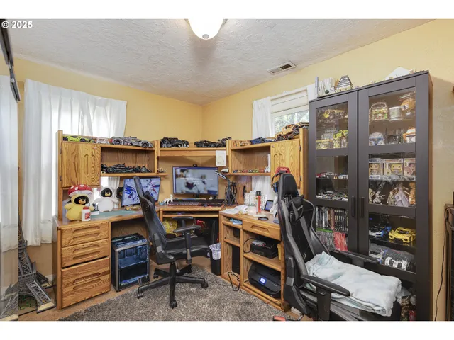 a view of a workspace with furniture
