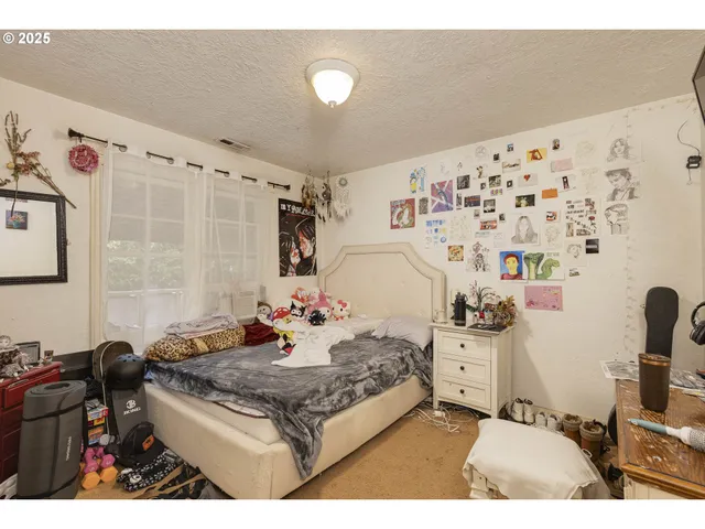 a living room with a couch and a dining table