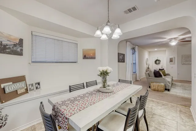 a kitchen with stainless steel appliances granite countertop a sink stove microwave and refrigerator