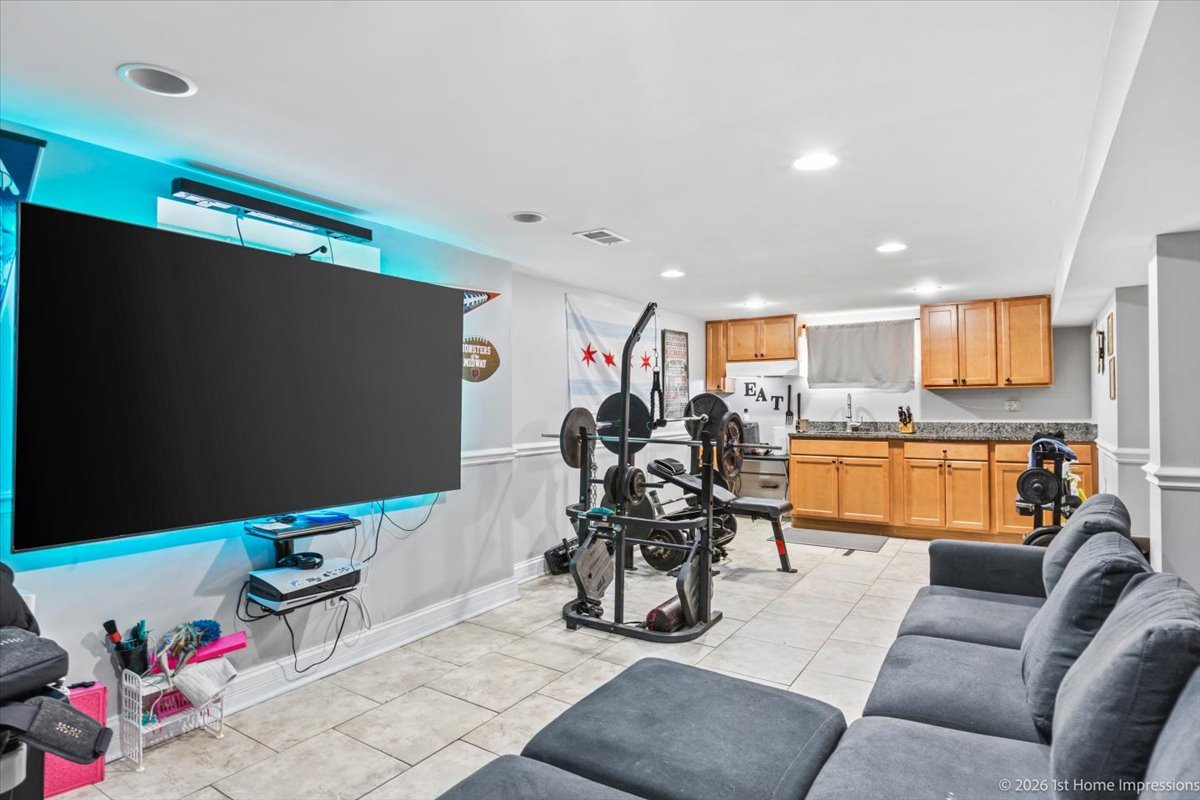 7205 South Hamlin Avenue Chicago, IL 60629 - Photo 14 of 24 a living room with furniture and a flat screen tv