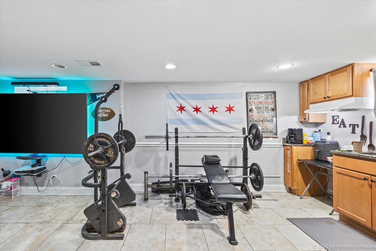 7205 South Hamlin Avenue Chicago, IL 60629 - Photo 15 of 24 a view of a room with gym equipment