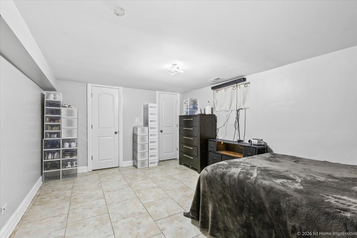 7205 South Hamlin Avenue Chicago, IL 60629 - Photo 19 of 24 a bedroom with a bed and a walk in closet