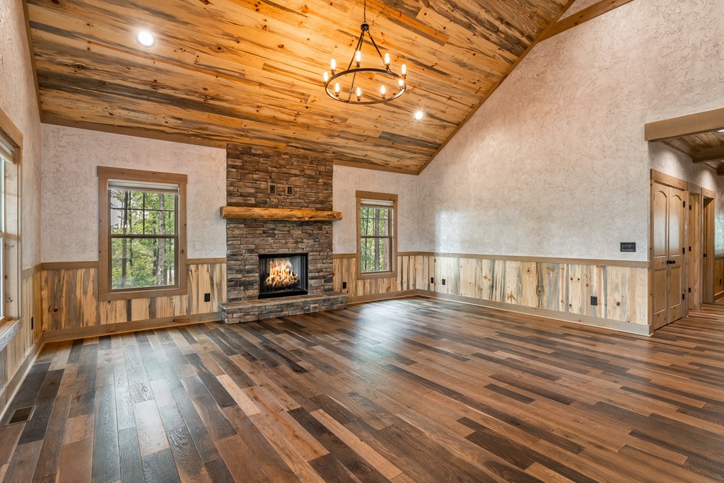 1450 Twisted Oak Road Talking Rock, GA 30175 - Photo 22 of 59 a view of empty room with wooden floor and fireplace