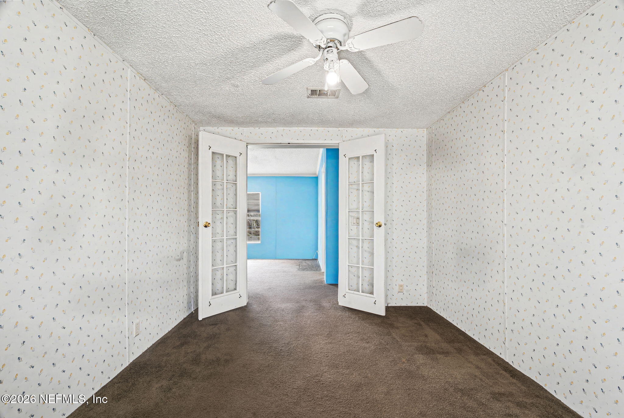 2910 Marshbank Road Jacksonville, FL 32224 - Photo 15 of 45 an empty room with a ceiling fan and a bathroom