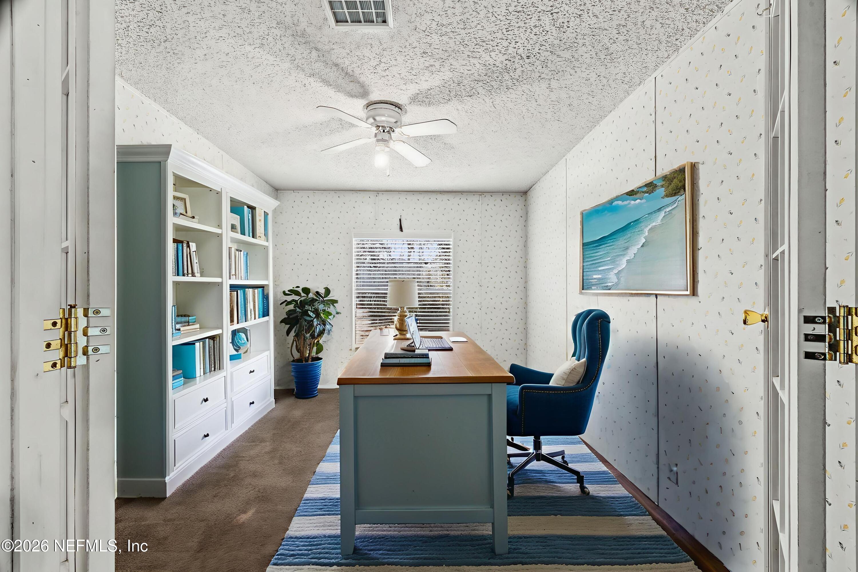 2910 Marshbank Road Jacksonville, FL 32224 - Photo 17 of 45 a view of a workspace with furniture and a window