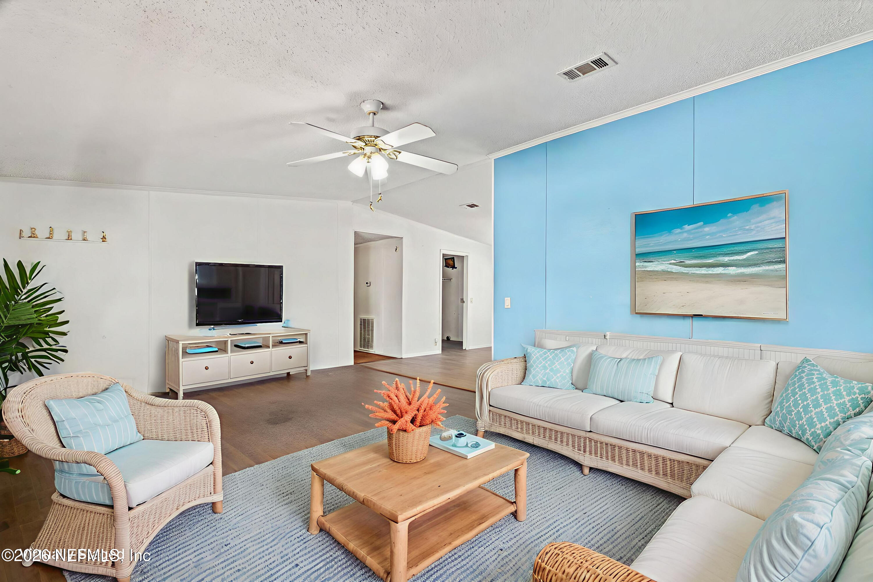 2910 Marshbank Road Jacksonville, FL 32224 - Photo 10 of 45 a living room with furniture a flat screen tv and a couch