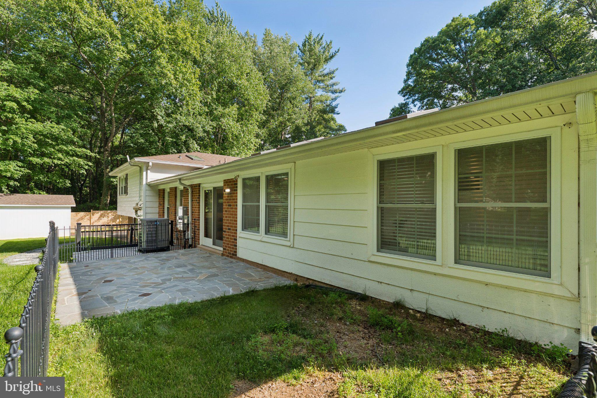 3219 Fox Mill Road Oakton, VA 22124 - Photo 62 of 87 Charming home with lush greenery backdrop.