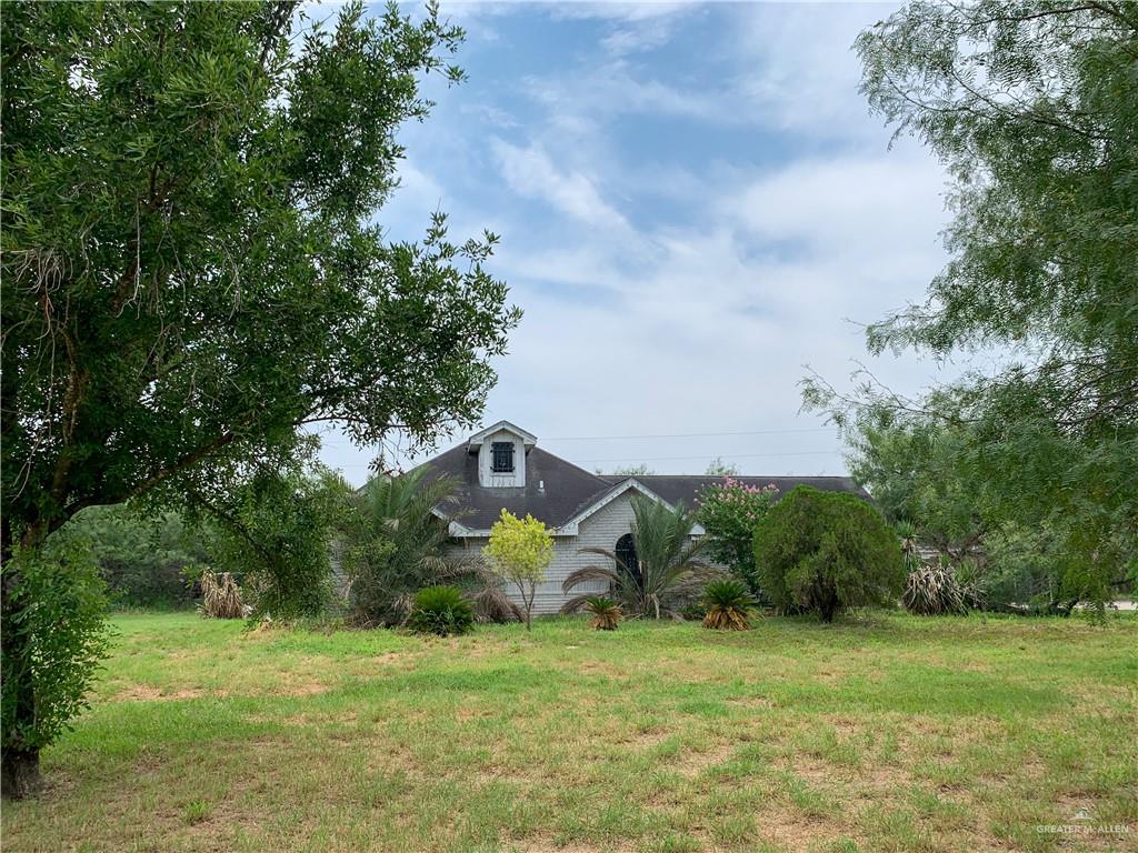 a backyard of a house with lots of green space