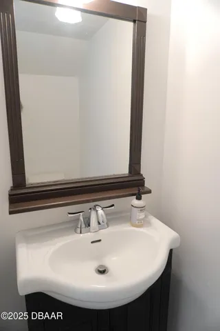 a bathroom with a toilet a sink and shower