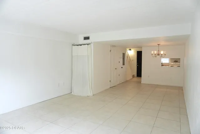 an empty room with a bathroom