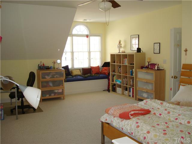 4105 Heathgate Lane Raleigh, NC 27613 - Photo 12 of 12 The bonus room is currently used as a bedroom. There are more windows and the spacious reading nook is especially pleasant.