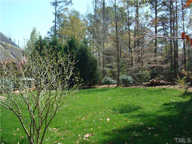 4105 Heathgate Lane Raleigh, NC 27613 - Photo 10 of 12 Looking across the back yard. Note that th hot tub on the left conveys.