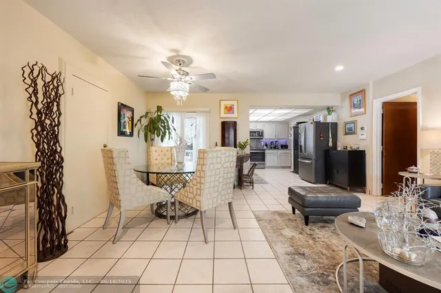 a view of a livingroom with furniture and a flat screen tv