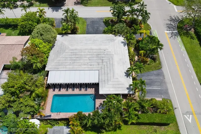 an aerial view of a house with a garden