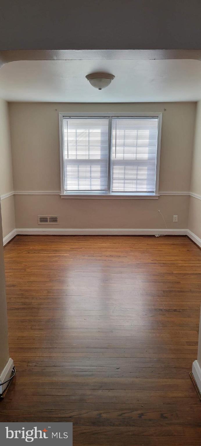 8203 Lasalle Road Towson, MD 21286 - Photo 11 of 17 a view of empty room with wooden floor and fan