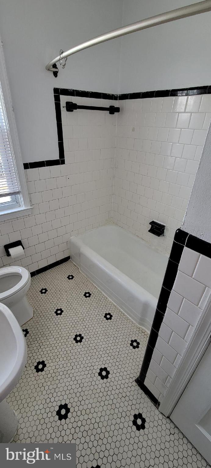 8203 Lasalle Road Towson, MD 21286 - Photo 16 of 17 a bathroom with a bathtub and a shower