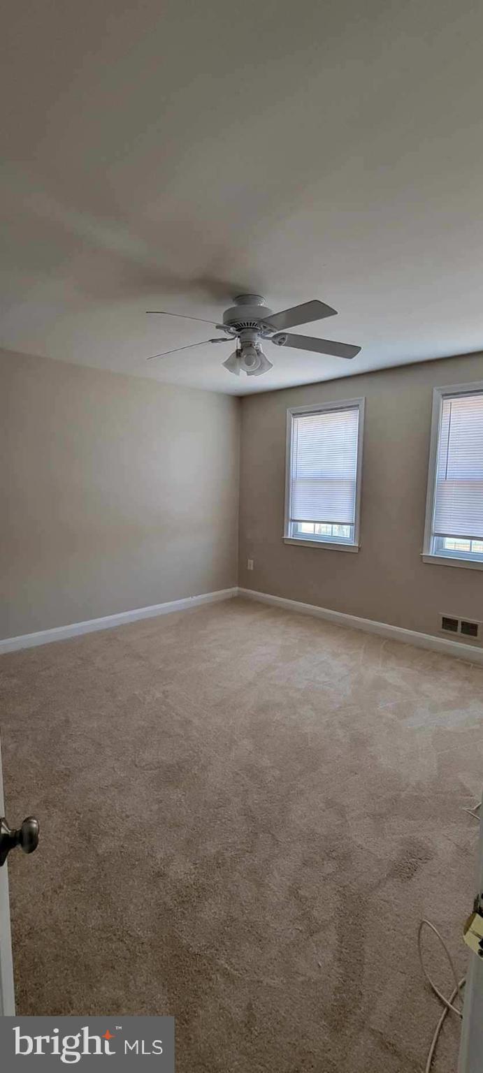8203 Lasalle Road Towson, MD 21286 - Photo 17 of 17 an empty room with a empty space and windows