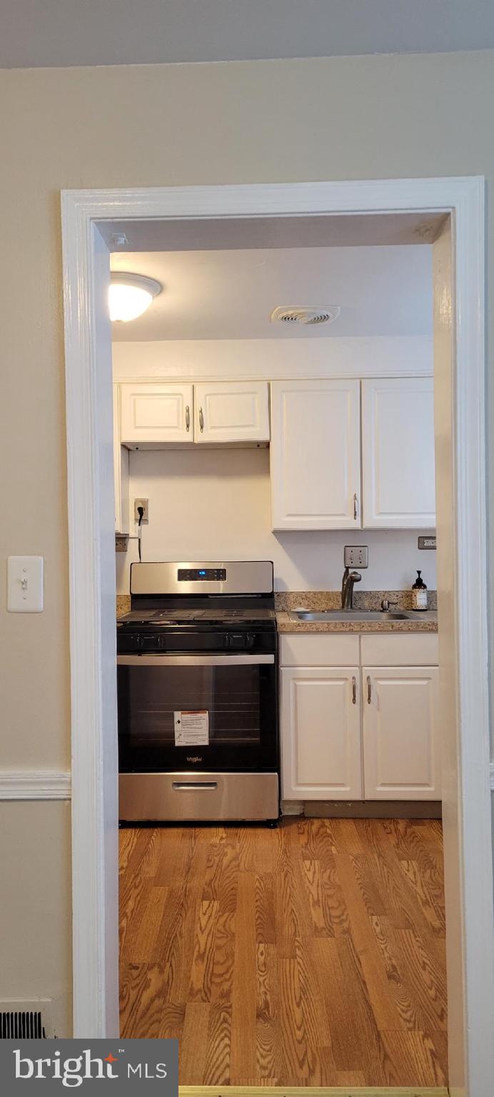 8203 Lasalle Road Towson, MD 21286 - Photo 5 of 17 a stove top oven sitting inside of a kitchen