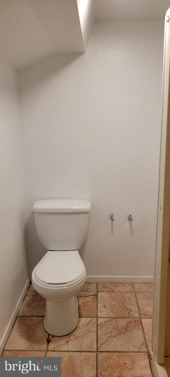 8203 Lasalle Road Towson, MD 21286 - Photo 9 of 17 a white toilet sitting next to a shower