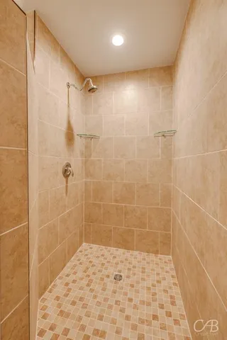 a bathroom with a sink vanity and a mirror