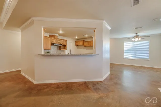 a view of a dining room with furniture and window