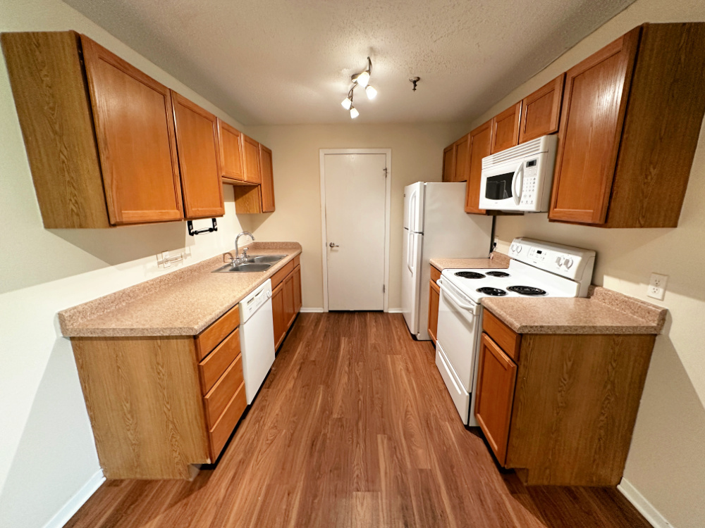 1330 Brook Street, Unit M St. Charles, IL 60174 - Photo 2 of 11 a kitchen with stove and wooden floor