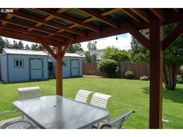 412 Camellia Court Reedsport, OR 97467 - Photo 7 of 48 a view of a porch with furniture and a yard