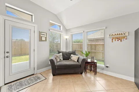a living room with furniture and a window