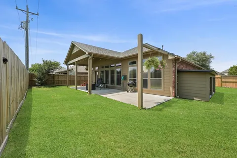 an aerial view of a house with big yard
