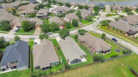a couple of cars parked in front of house