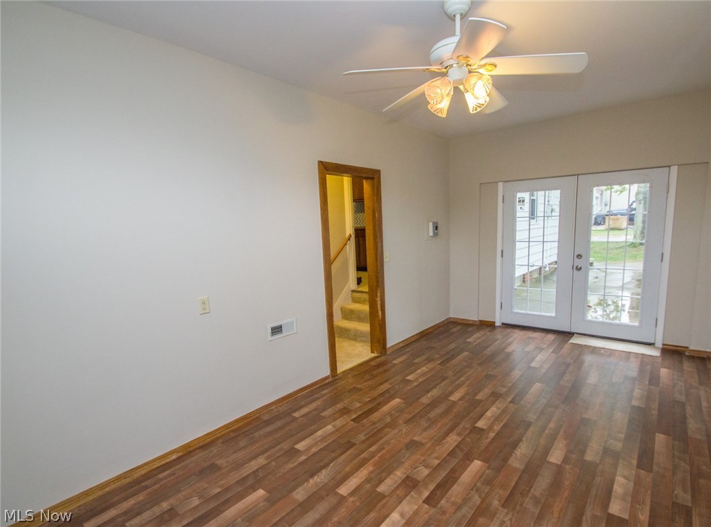 10571 Snow Road Parma Heights, OH 44130 - Photo 9 of 25 Family room with wood laminate floor