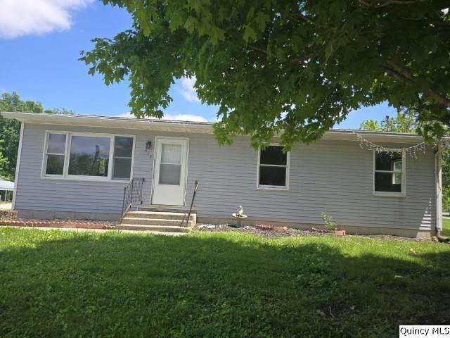 219 South 1st Street Carthage, IL 62321 - Photo 24 of 28 a front view of house with yard and green space
