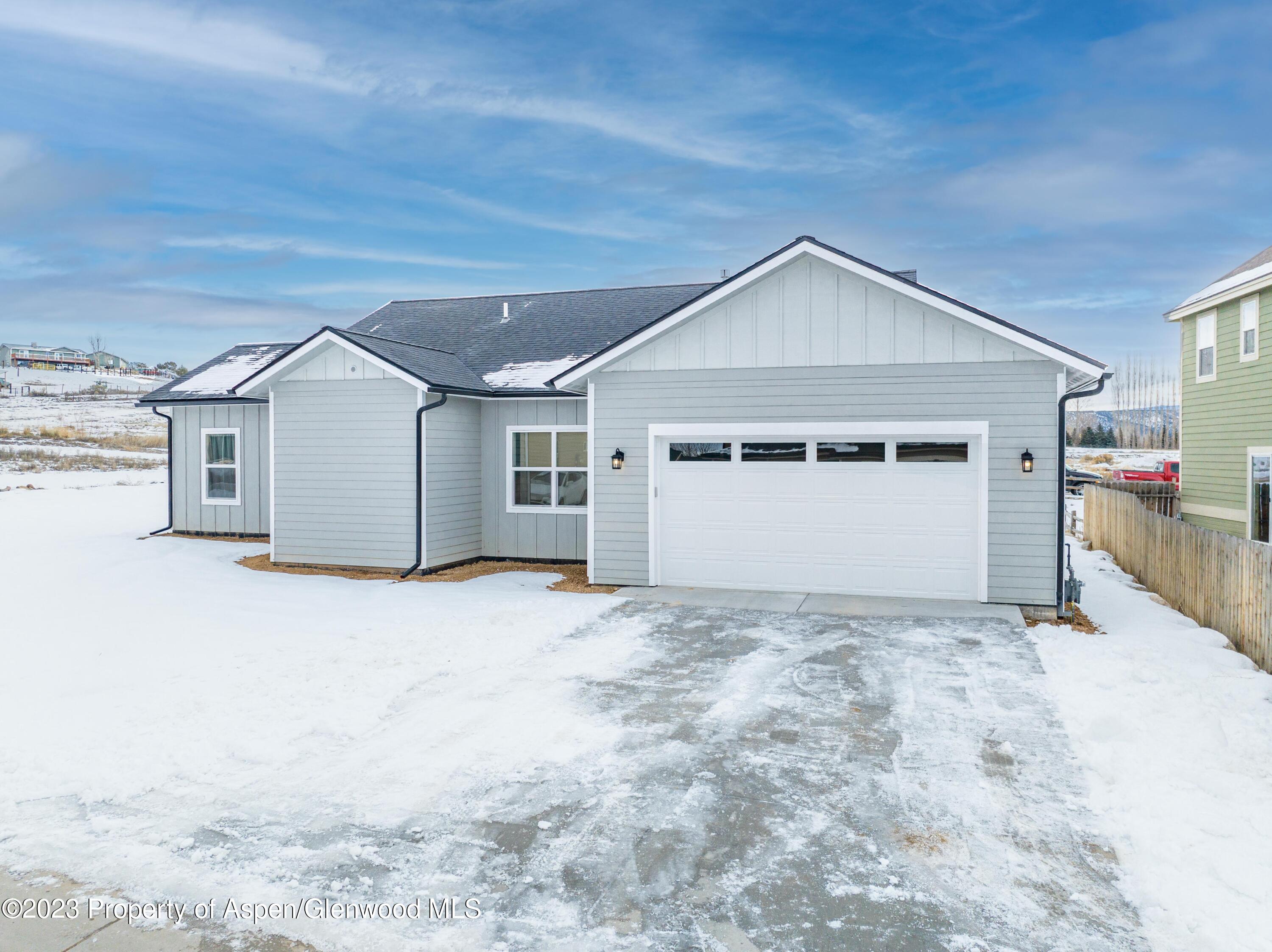 1089 Bedrock Circle Silt, CO 81652 - Photo 3 of 16 a view of a house with a yard and garage