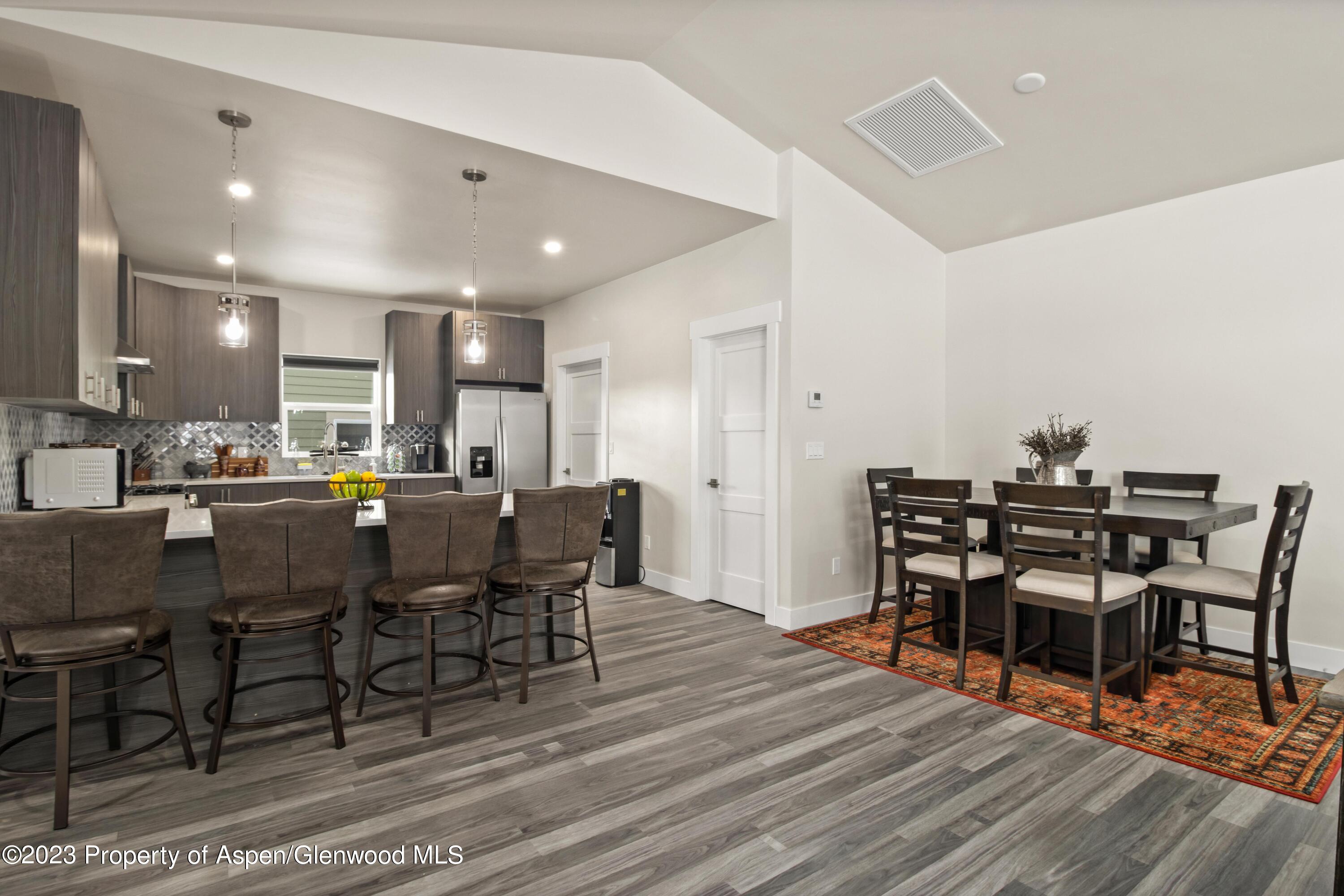 1089 Bedrock Circle Silt, CO 81652 - Photo 7 of 16 a view of a dining room with furniture and wooden floor