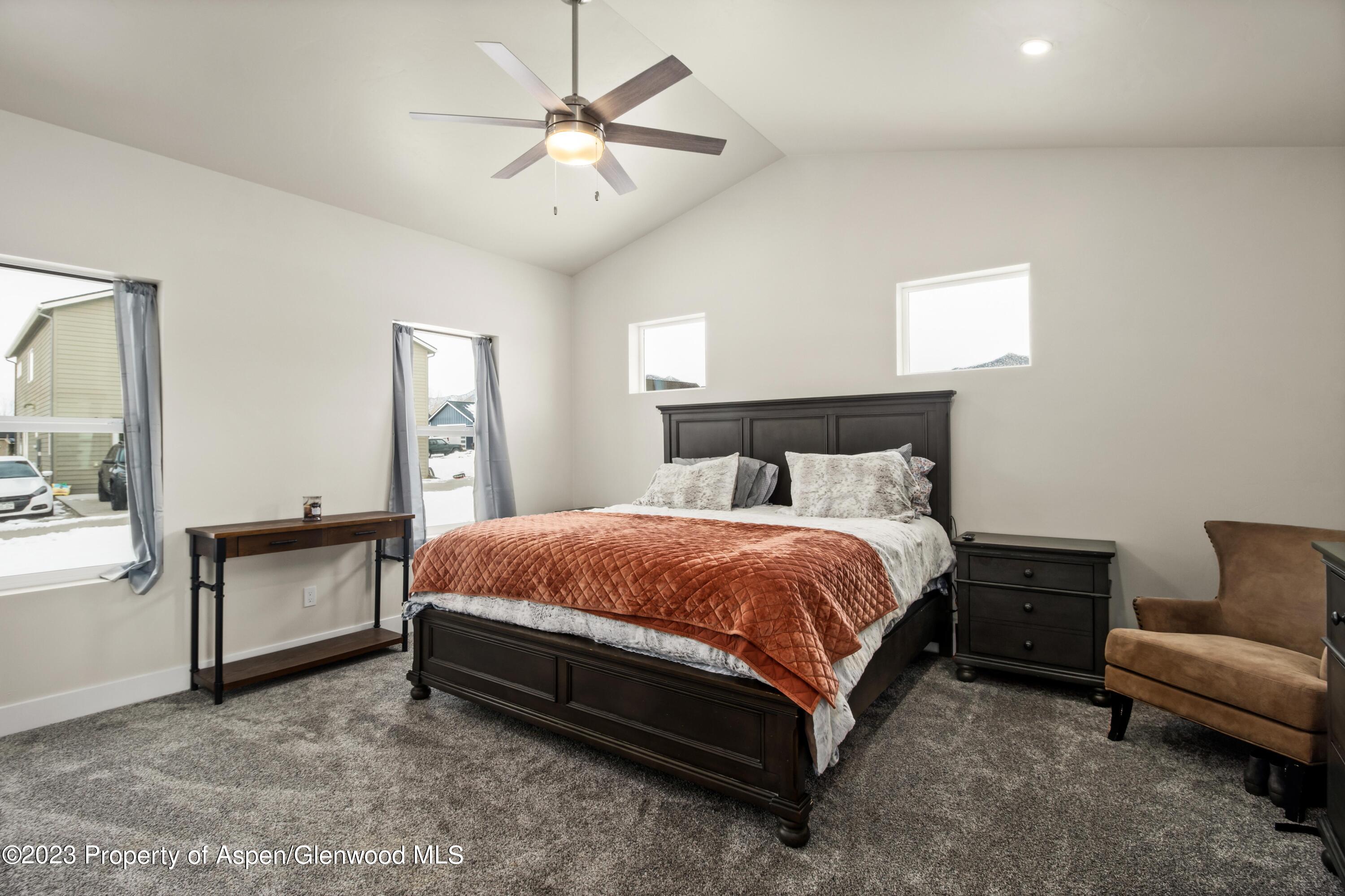 1089 Bedrock Circle Silt, CO 81652 - Photo 9 of 16 a spacious bedroom with a bed and furniture