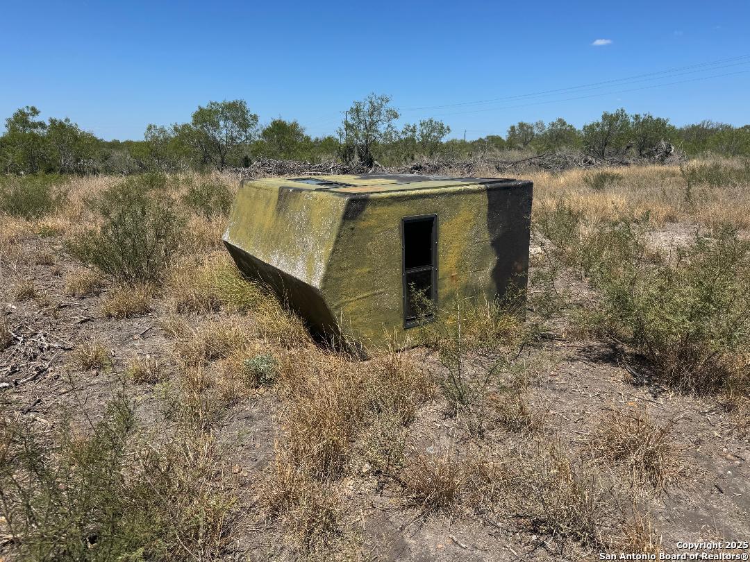 985 Franklin Rnch Road Jourdanton, TX 78026 - Photo 4 of 6 a view of a lake with a mountain in the background