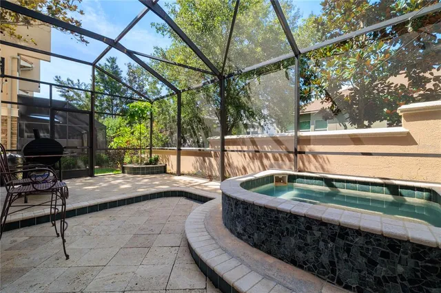 a view of a backyard with sitting area