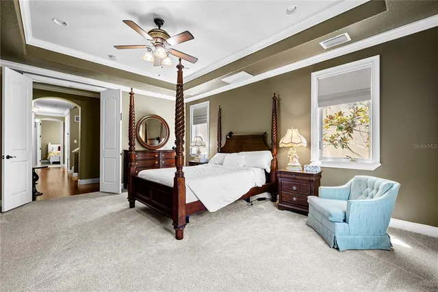 a bedroom with bed and window