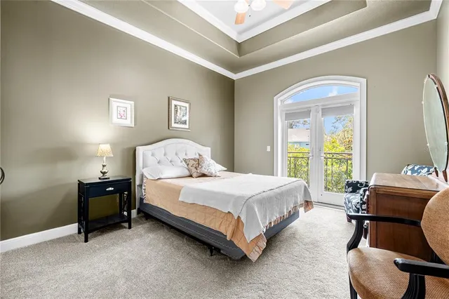 a bedroom with a bed and a lounge chair