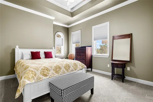 a bedroom with a bed and a table in it