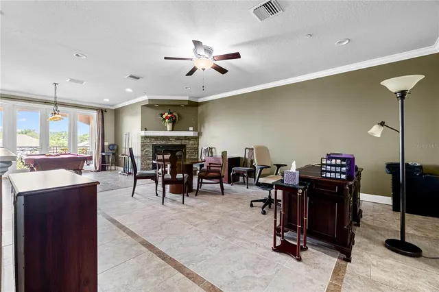 a living room with furniture and kitchen view
