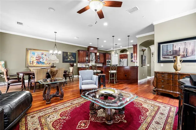 a living room with lots of furniture and kitchen view