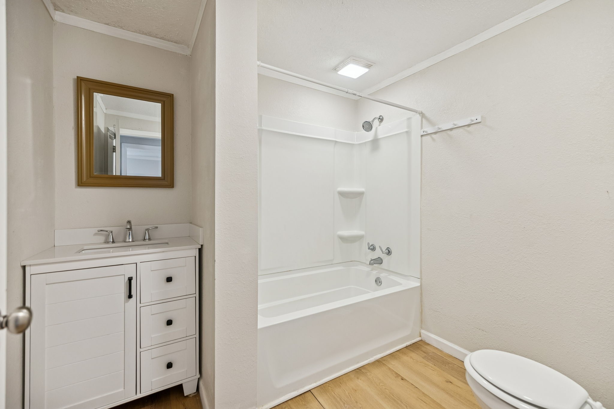 396 Pomona Road Crossville, TN 38571 - Photo 12 of 17 a bathroom with a granite countertop sink a toilet and shower